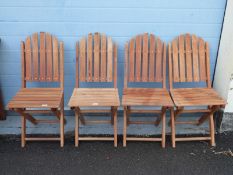 Four folding garden chairs