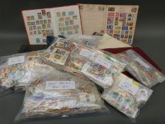 A box of GB and foreign stamps, loose and in albums, together with first day covers.