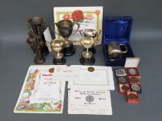 A collection of horticultural medals and cups comprising three bronze and four silver plated