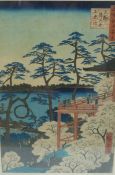 A late 19th/20thC Japanese hand coloured print of figures on a pagoda overlooking a lake,