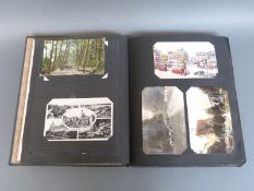 An album of early to mid twentieth century English and overseas postcards to include humorous,