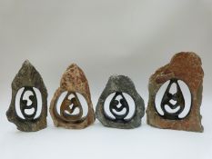 Four Shona African stone carvings of stylised couples dancing,