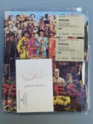 Paul McCartney signed postcard with a collection of Wings and Paul McCartney ephemera,