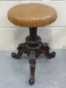 An adjustable 19thC piano stool