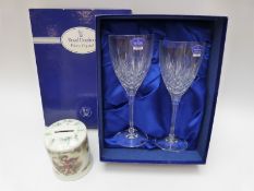 A pair of boxed cut glass Royal Doulton wine glasses and a Royal Worcester money box