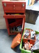 A garage tool chest on cabinet with contents including pullers, spanner,