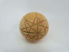 A Dieppe carved ivory ball opening to reveal carved scenes of Jerusalem / Holy Land,