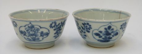 A pair of Chinese blue and white 18thC pedestal tea bowls