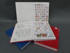 A stockbook of mint Commonwealth stamps and three well filled stockbooks of used Commonwealth