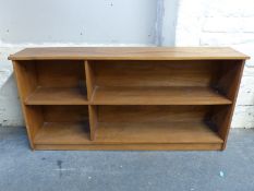 An elm or similar shelf unit,
