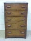 An oak chest of five drawers, marked to top drawer McNamee, Durban, W70.