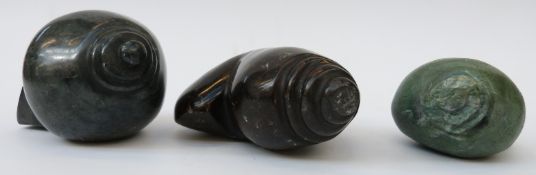 Three Africa Shona stone carvings of stylised shells, two signed Noel Mwanza,
