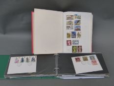 A first day cover album including bank notes, booklet etc,