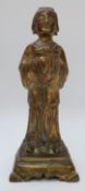 An early 20thC Chinese brass figure with gilt decoration,