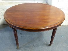 A circular mahogany dining table,