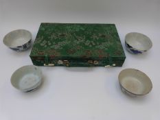 A wooden and bone Mah-Jong set in fabric covered box and four 19thC / 20thC blue and white bowls