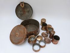 An Indian copper betel nut box with embossed decoration, 25.