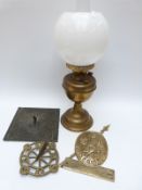 A 19thC/early 20thC bronze sundial decorated with figures, a brass sundial,