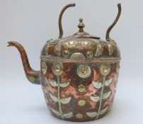 An Indian copper kettle with embossed foliate decoration,