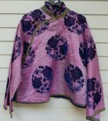 A late 19th/20thC Chinese pink silk short coat with blue flock peony and butterfly decoration and