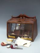 A point of sale/advertising tobacco cabinet with pipes,