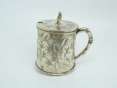 A Chinese white metal mustard with engraved bamboo decoration and faux bamboo handle and knop,