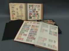 A stockbook of Finland stamps and three stockbooks of foreign stamps
