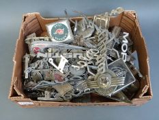A large quantity of mainly 1930's, 70's and 80's car badges including Caravan Club, Alfa Romeo,