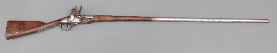 Belgian flintlock hammer action gun with indistinctly named lock, pierced hammer, steel butt plate,