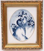 A Meissen porcelain plaque of two turtle doves in prunus blossom,