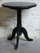 A circular tripod table