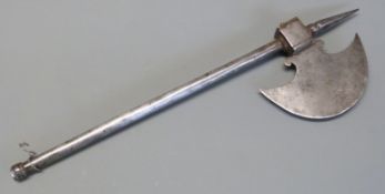 A 19thC Indian metal axe with swollen crescent shaped blade, central spike and square socket, 43.