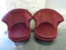 A pair of upholstered tub chairs