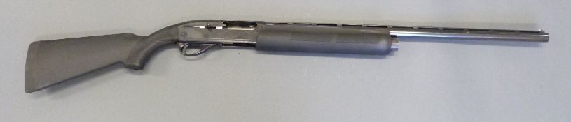 Remington model 1100 12 bore semi-automatic shotgun with semi-pistol grip, engraved lock,