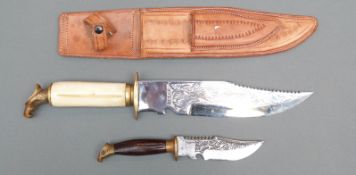 A bone handled Mexican sheath knife with smaller integrated example both with eagle head,