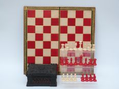 Jaques of London Staunton carved ivory library chess set with natural and stained red pieces,