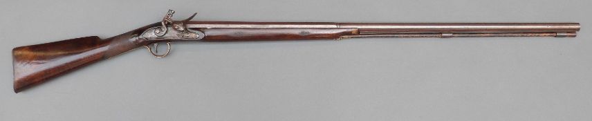 Flintlock hammer action sporting gun with engraved lock,