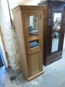 A pine single door wardrobe with part mirrored door,