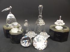 Six Swarovski Crystal paperweights and candle holders in the form of flames, birthday cake,
