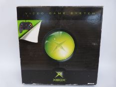 X-box video game system, in original box.