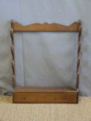 A wall mountable four gun rack with lockable drawer below,