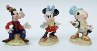 Three Beswick Disney figures comprising Goofy, Minnie Mouse and Jiminy Cricket,