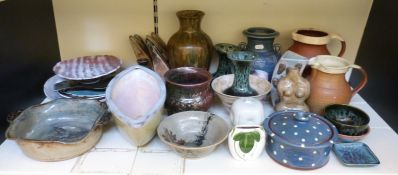 A large collection of studio pottery, some with impressed marks,
