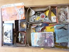 A collection of various Meccano parts, booklets and instructions including motors, pulleys,