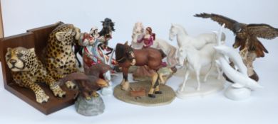 A collection of ceramic and resin figures including eagles, horses, leopard book ends,
