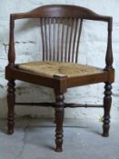 A late 19thC/early 20thC corner chairs with quarter woven seagrass seats
