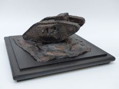 WWI diorama of a British tank crossing no man's land and barbed wire,