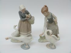 A collection of Lladro figures comprising girl with flowers,
