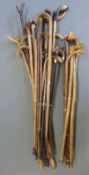 A large collection of walking sticks, thumb sticks,