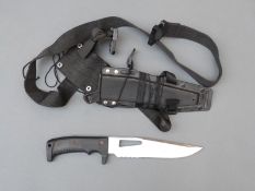 A modern stainless steel bladed diver's knife in scabbard with belt